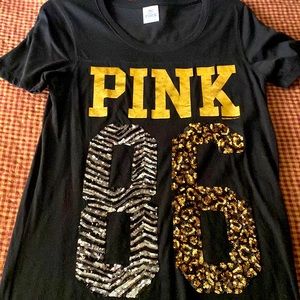 Pink Brand Black tee shirt with gold and silver sequins on front.